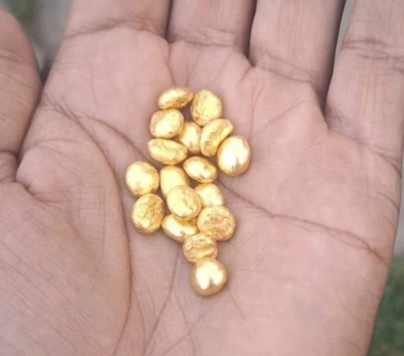 Gold nugget in hand